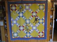 Full view of the quilt hanging, showing overall design, colours and dimensions perspective