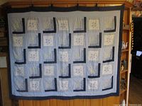 Full view of quilt hanging to show overall design and size
