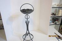 Full view of wrought iron ashtray stand with glass ashtray