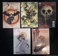 Front view of five bagged 5 Ronin comics showing cover art for Wolverine, Hulk, Punisher, Psylocke, Deadpool