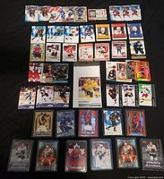 Full layout of all hockey trading cards in lot