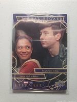 Front of Eternal Regard Duals insert card in sleeve showing character portraits and gold border