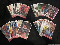 All 33 comics spread in groups showing front covers