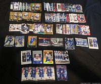 Wide view of entire lot laid out in rows showing volume and variety of cards