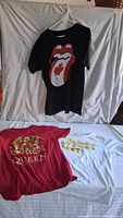 All three band T-shirts displayed