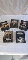 All five Boardwalk Empire season DVD boxes displayed