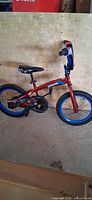 Side view of full Spiderman kids bike
