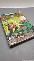 Stack of Green Lantern/Green Arrow comics, top issue 35¢ cover