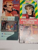 Four magazines including The Police Chronicles, Duran Duran Scrapbook, John Lennon tribute, and Duran Duran Their Story