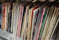 Row of LP records on shelf, spines visible