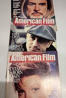 Three American Film magazines stacked, partial covers visible