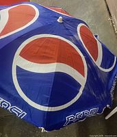 Top view of blue Pepsi logo canopy showing color and graphics