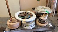 Stacked rolls of various edge banding materials on pallet
