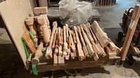 Full pallet showing variety of unfinished wooden balusters and table legs
