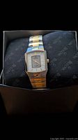 Front view of Bulova rectangular watch in box showing dial and bracelet
