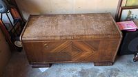 Top-down view of cedar blanket chest showing veneer exterior and overall condition