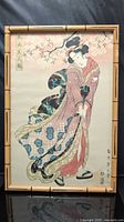 Front view of framed ukiyo-e style print in bamboo-look frame