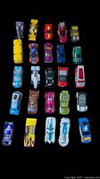 Top-down view of first group of 24 die-cast vehicles