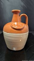 Front view of two-tone stoneware whisky jug