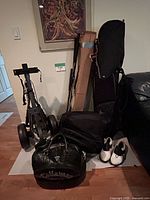 Overall lot with bags, cart, shoes, club box