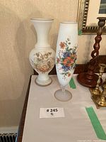 Both frosted glass vases on sideboard