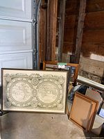Group view showing world map print, assorted frames and mirror