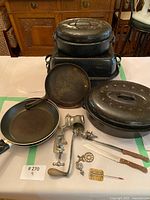 All cookware and utensils arranged on table