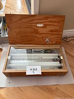 Light table open showing fluorescent tubes and clear top panel