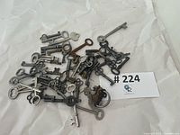 pile of assorted skeleton keys on paper