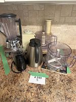 Group of Braun food processor, Philips blender, stainless kettle, Toastmaster chopper, extra processor bowl