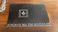 International Fine Silverplate placard