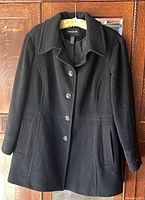 Front view showing buttons, collar, pockets