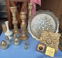 Full lot showing candlesticks, charger, vases, shakers, salt cellars, plaque and knob