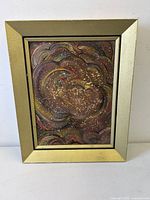 Frontal view of framed painting showing artwork and frame