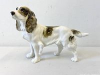 Left profile of full figurine