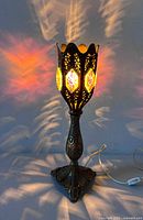 Lamp lit showing colorful light patterns, full view