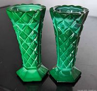 Front view of both jade green vases showing diamond pattern