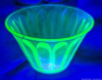 Cup glowing bright green under UV light