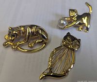 Front view of all three brooches