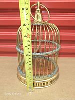 cage front view with tape showing height