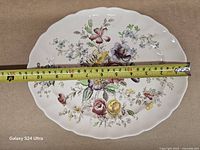 Front view with tape measure confirming 11 in length