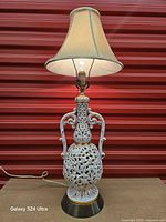 Lamp with shade illuminated showing full appearance