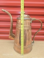 Full view front with tape measure showing height