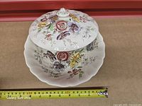 Covered bowl with lid on, tape showing diameter