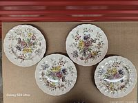 Top view of all four matching Sheraton dinner plates