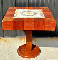 Full view of teak pedestal table showing overall design