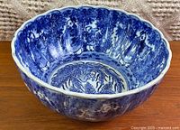 Oblique view showing exterior and interior decoration and scalloped rim