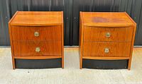 Front view of both teak nightstands showing drawers, pulls, and bases