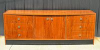 front view of teak low-boy dresser showing drawers, doors, pulls, plinth base