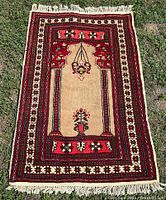 Full view of Afghan Baloch rug showing design and fringe